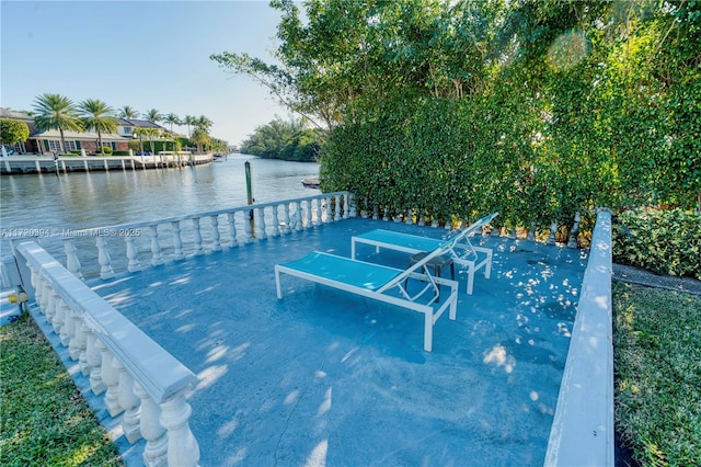 view of pool featuring a dock and a water view