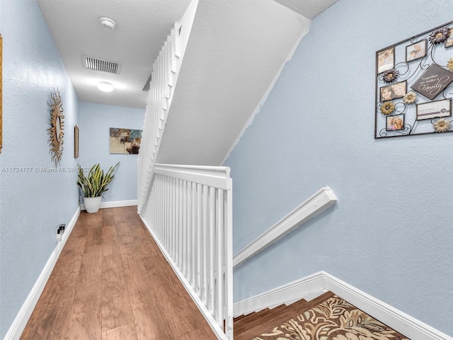 corridor featuring hardwood / wood-style floors