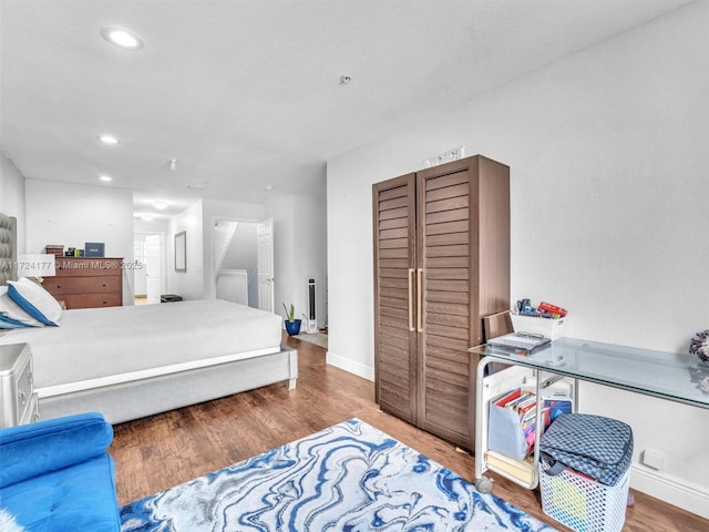 bedroom featuring wood-type flooring