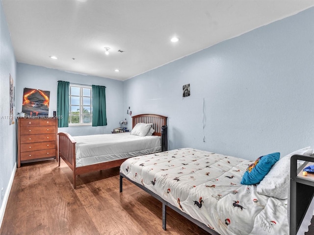 bedroom featuring hardwood / wood-style floors