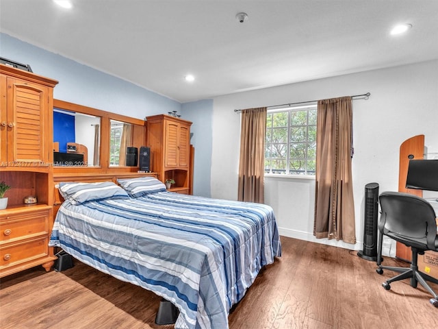 bedroom with hardwood / wood-style flooring