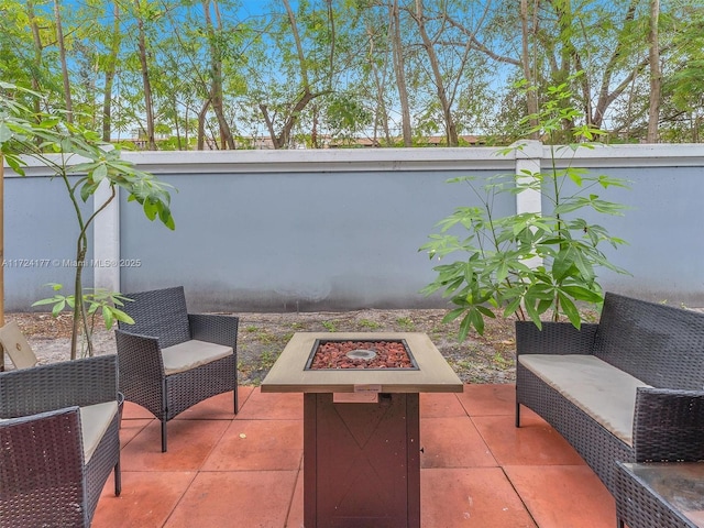 view of patio featuring an outdoor fire pit