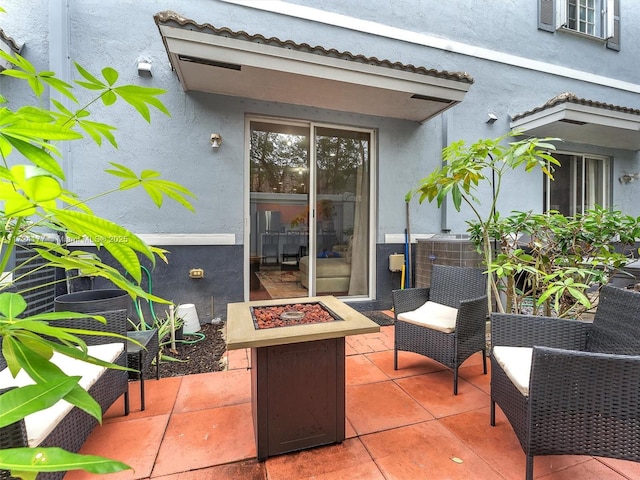 view of patio with a fire pit