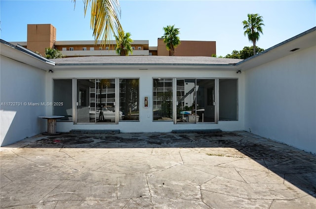 doorway to property featuring a patio