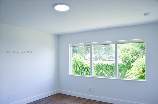 empty room featuring dark hardwood / wood-style floors