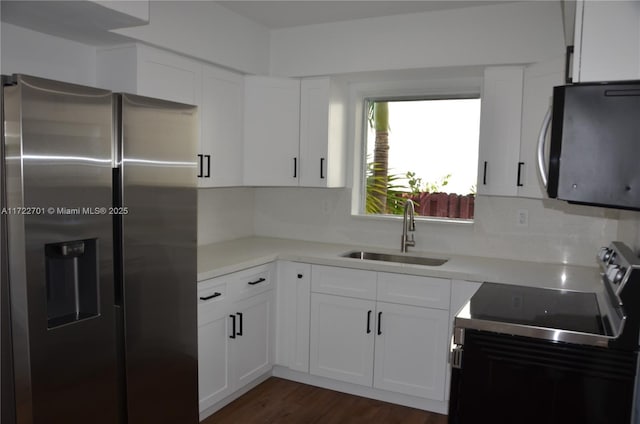 kitchen featuring sink, white cabinetry, and stainless steel fridge with ice dispenser