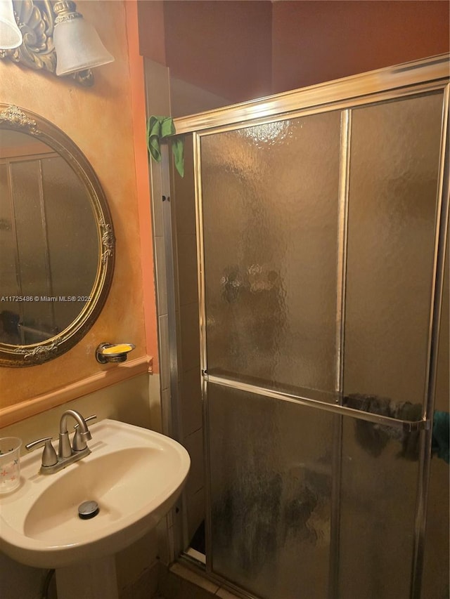 bathroom with sink and walk in shower