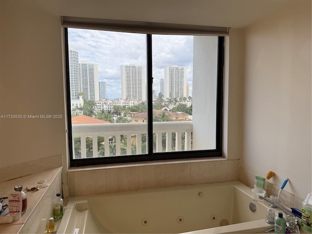 bathroom with a healthy amount of sunlight and a bathing tub