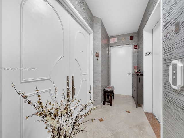 hallway featuring light tile patterned floors