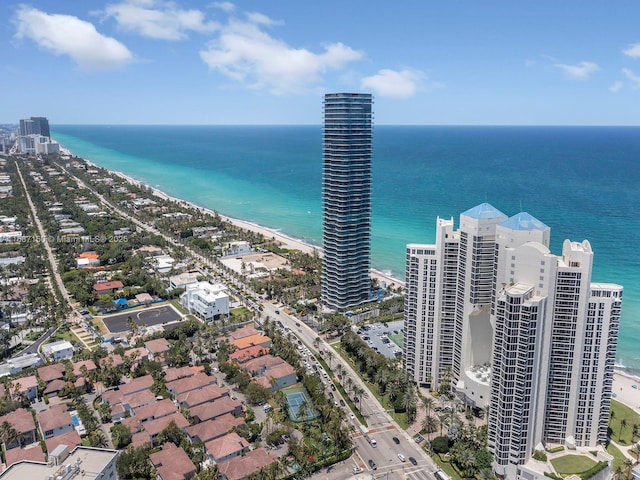 bird's eye view with a water view and a view of the beach