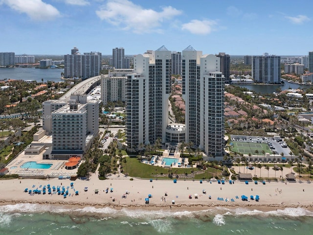 bird's eye view with a water view and a view of the beach