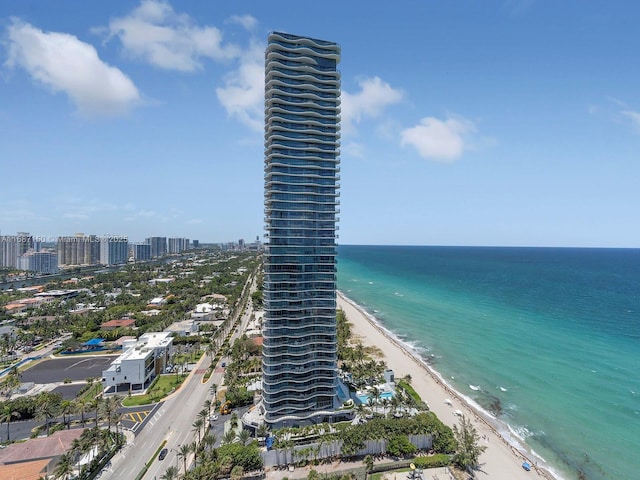 aerial view with a water view and a view of the beach