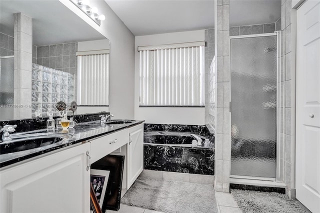 bathroom featuring vanity, separate shower and tub, and tile patterned flooring