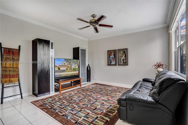 living room with ornamental molding, light tile patterned floors, ceiling fan, and a textured ceiling