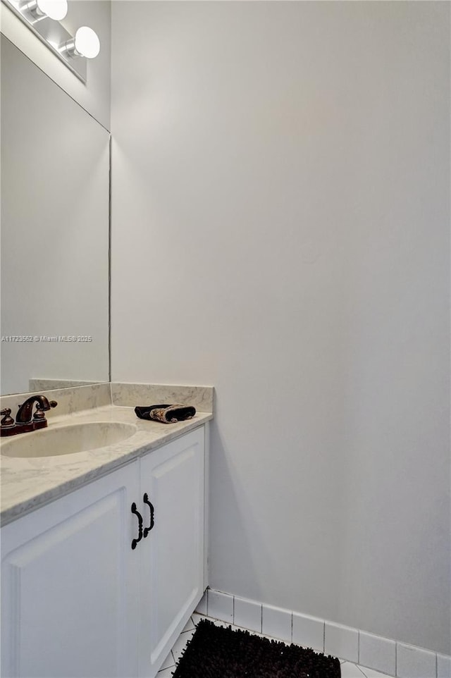 bathroom with tile patterned flooring and vanity