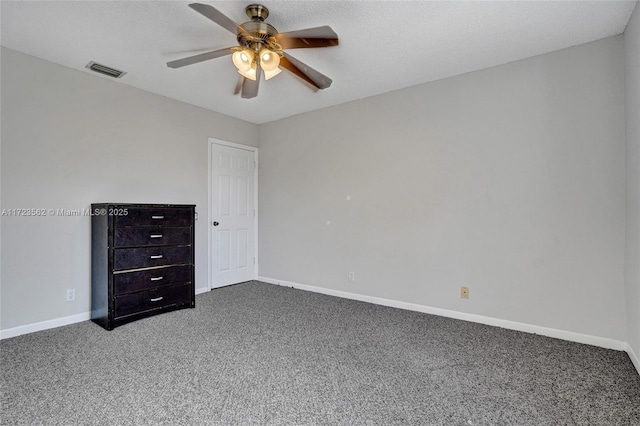 unfurnished bedroom featuring a textured ceiling, ceiling fan, and carpet flooring