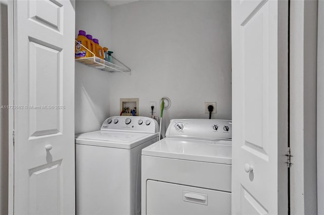 laundry room with independent washer and dryer