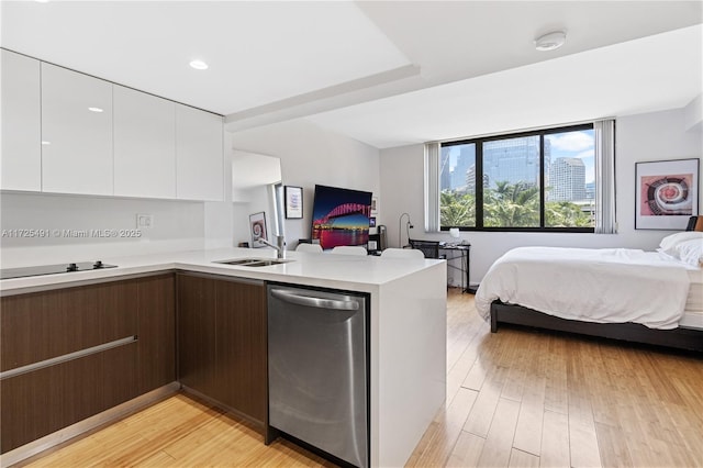 interior space with light hardwood / wood-style floors and sink