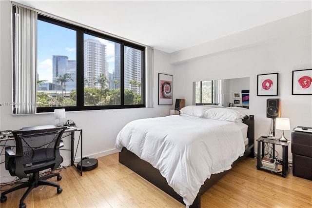 bedroom with wood-type flooring