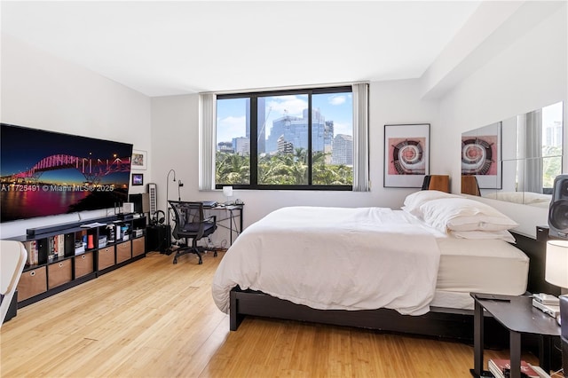 bedroom with hardwood / wood-style floors