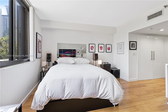 bedroom featuring light wood-type flooring