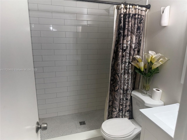 bathroom featuring toilet, curtained shower, and vanity