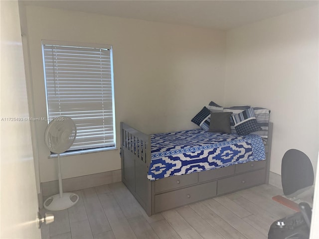 bedroom with light hardwood / wood-style flooring