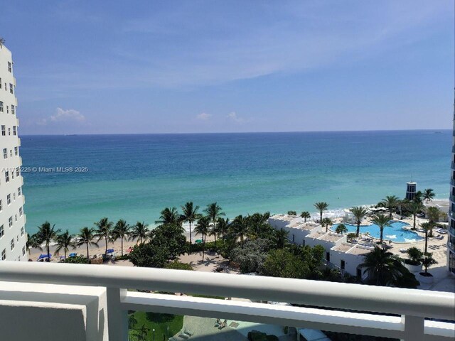 view of pool with a water view