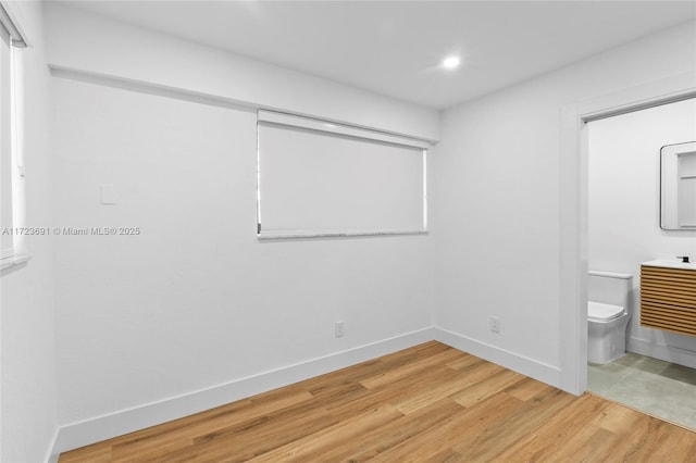 unfurnished bedroom with wood-type flooring