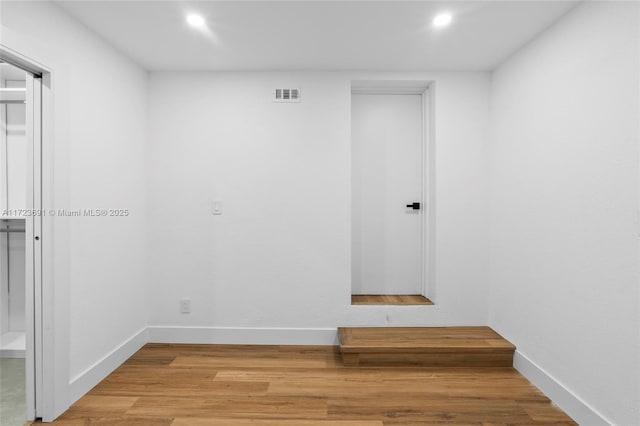 spare room featuring hardwood / wood-style flooring