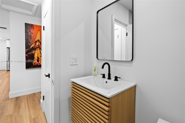 bathroom with wood-type flooring and vanity