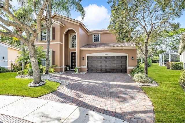 mediterranean / spanish-style house with a front yard, glass enclosure, and a garage