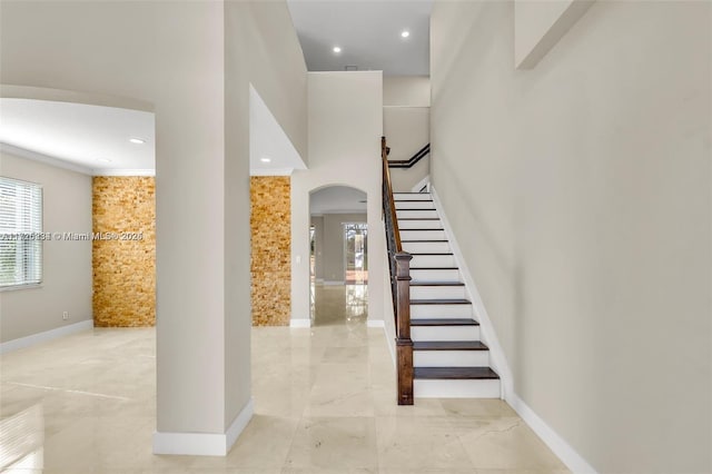 staircase with crown molding