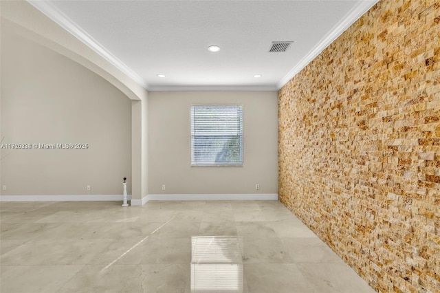 unfurnished room featuring ornamental molding