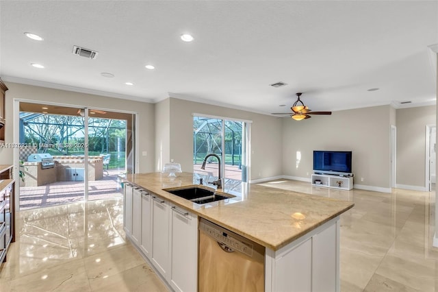 kitchen featuring sink, a kitchen island with sink, dishwasher, and white cabinetry