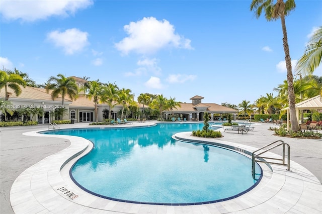 view of swimming pool with a patio