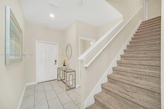 entryway featuring light tile patterned floors