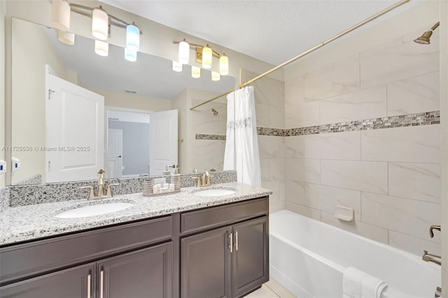 bathroom with shower / bath combo with shower curtain and vanity