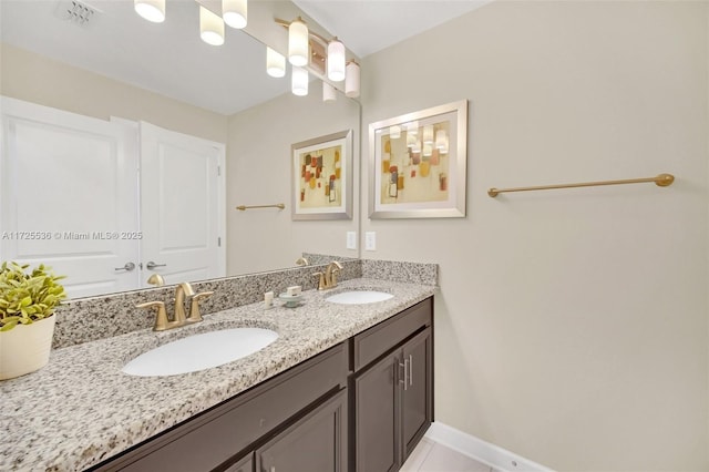 bathroom with vanity and tile patterned floors