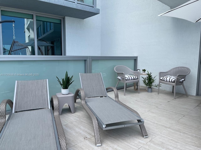 view of patio / terrace featuring a balcony