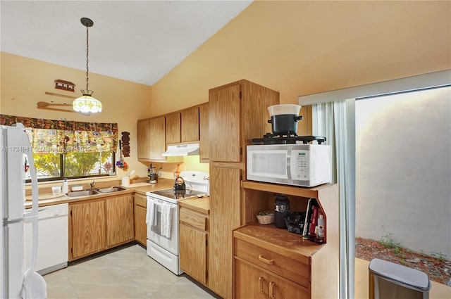 kitchen with vaulted ceiling, decorative light fixtures, sink, light tile patterned floors, and white appliances