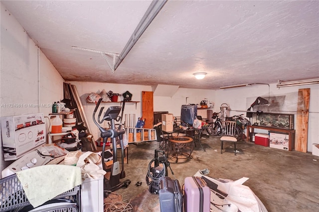 misc room featuring concrete flooring and a textured ceiling