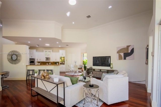 interior space with hardwood / wood-style floors, baseboards, and ornamental molding