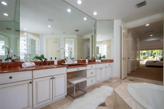kitchen with built in appliances, visible vents, a peninsula, white cabinetry, and dark wood-style floors