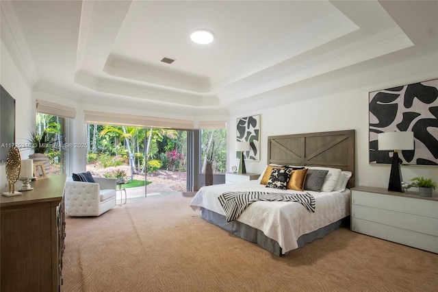 bedroom with access to outside, a raised ceiling, visible vents, and crown molding