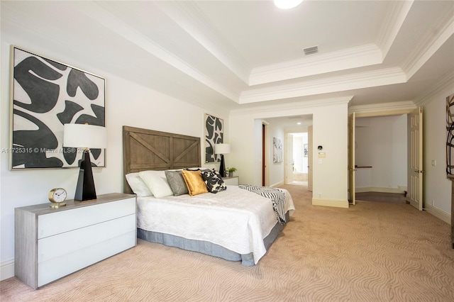 bedroom with light colored carpet, visible vents, baseboards, a tray ceiling, and crown molding