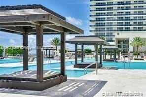 view of pool with a gazebo and a patio area