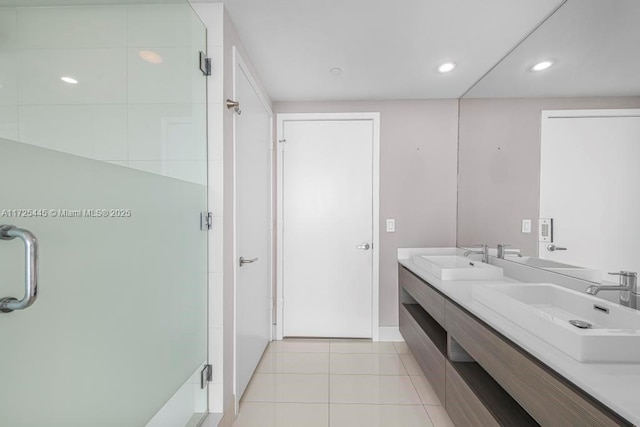 bathroom featuring walk in shower, tile patterned floors, and vanity