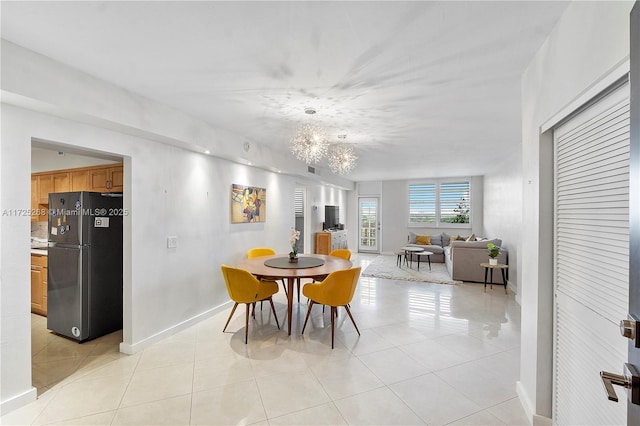 dining area featuring light tile patterned flooring