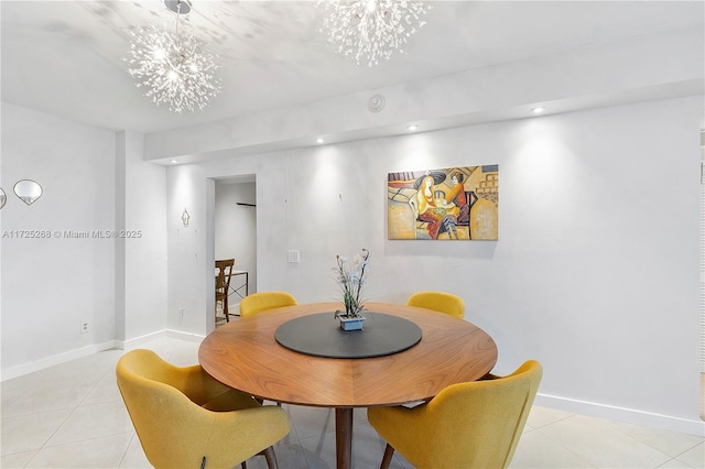 dining room featuring light tile patterned flooring and a chandelier